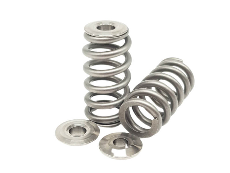 Two metallic springs with a white background